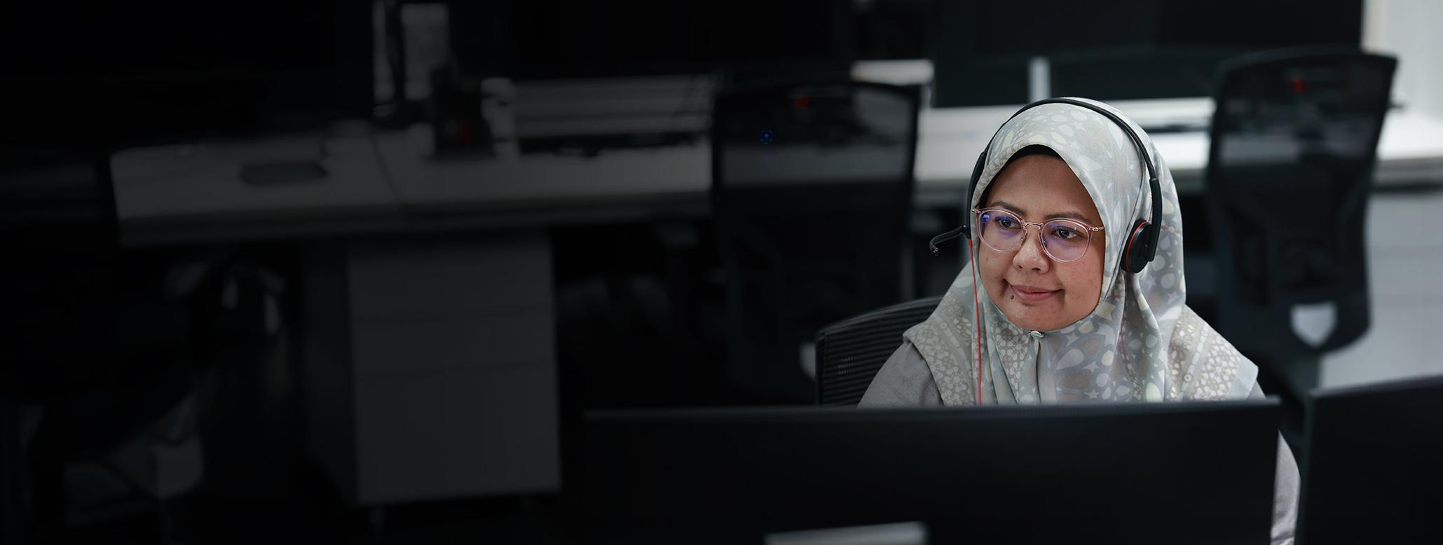 Female sitting at computer