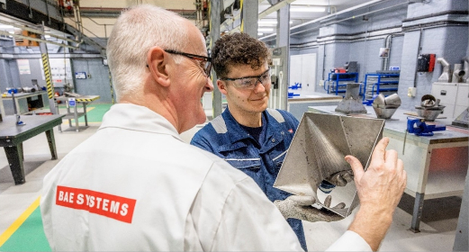 A Level 2 apprentice is trained by an experienced colleague at BAE Systems