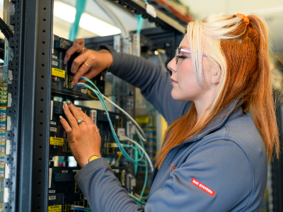 A BAE Systems electrician at work in HMS Collingwood