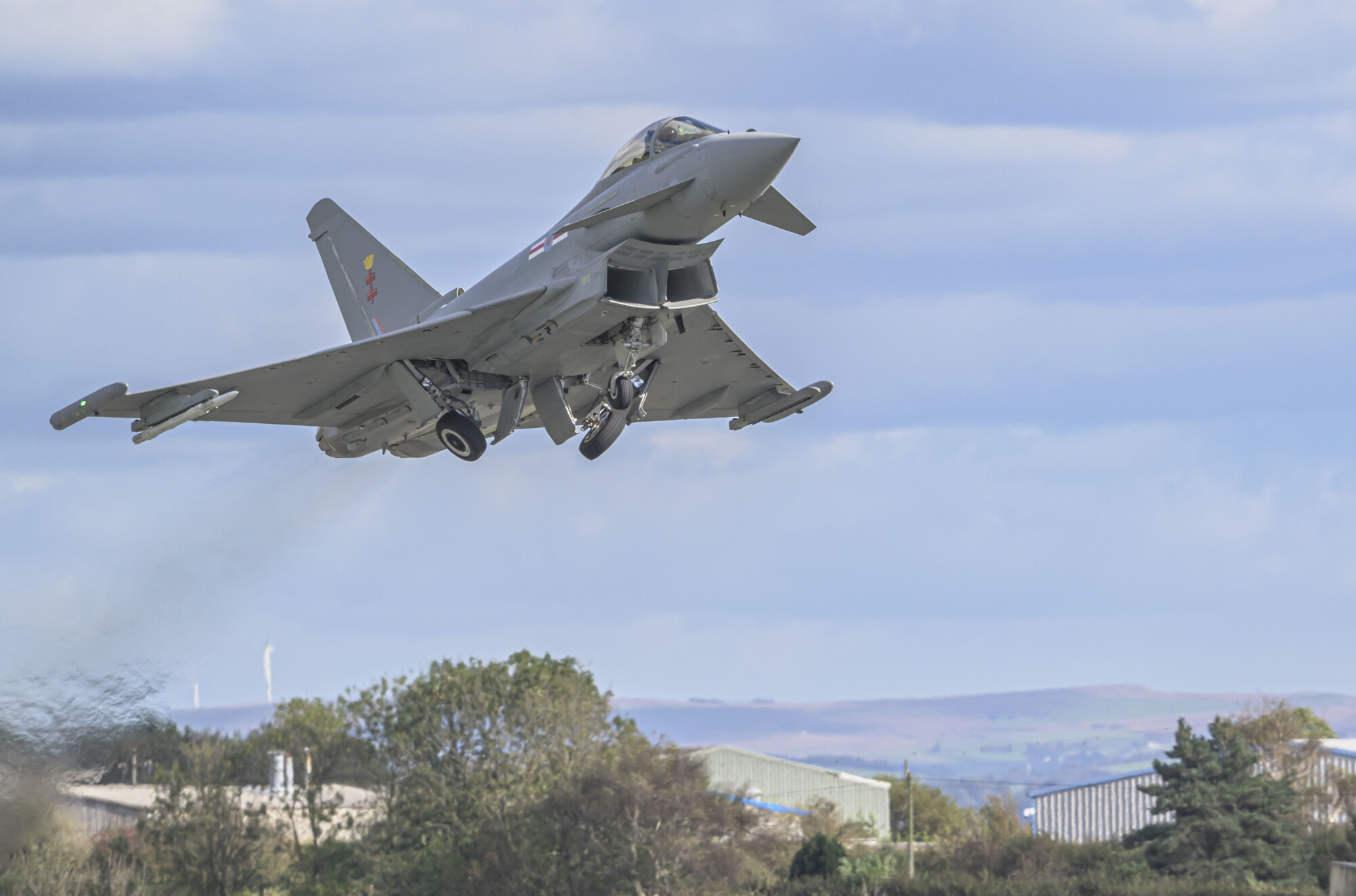 A Typhoon jet fitted with ECSR Mk2 radar taking flight from a testing facility at Warton, Lancashire