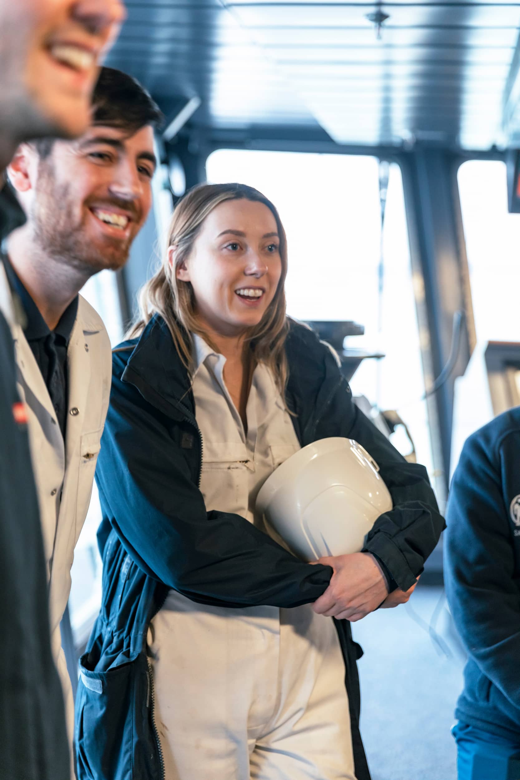 Laughing employees in ship