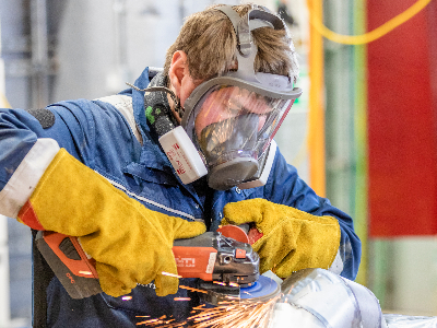 A BAE Systems welding professional at work in Portsmouth Naval Base