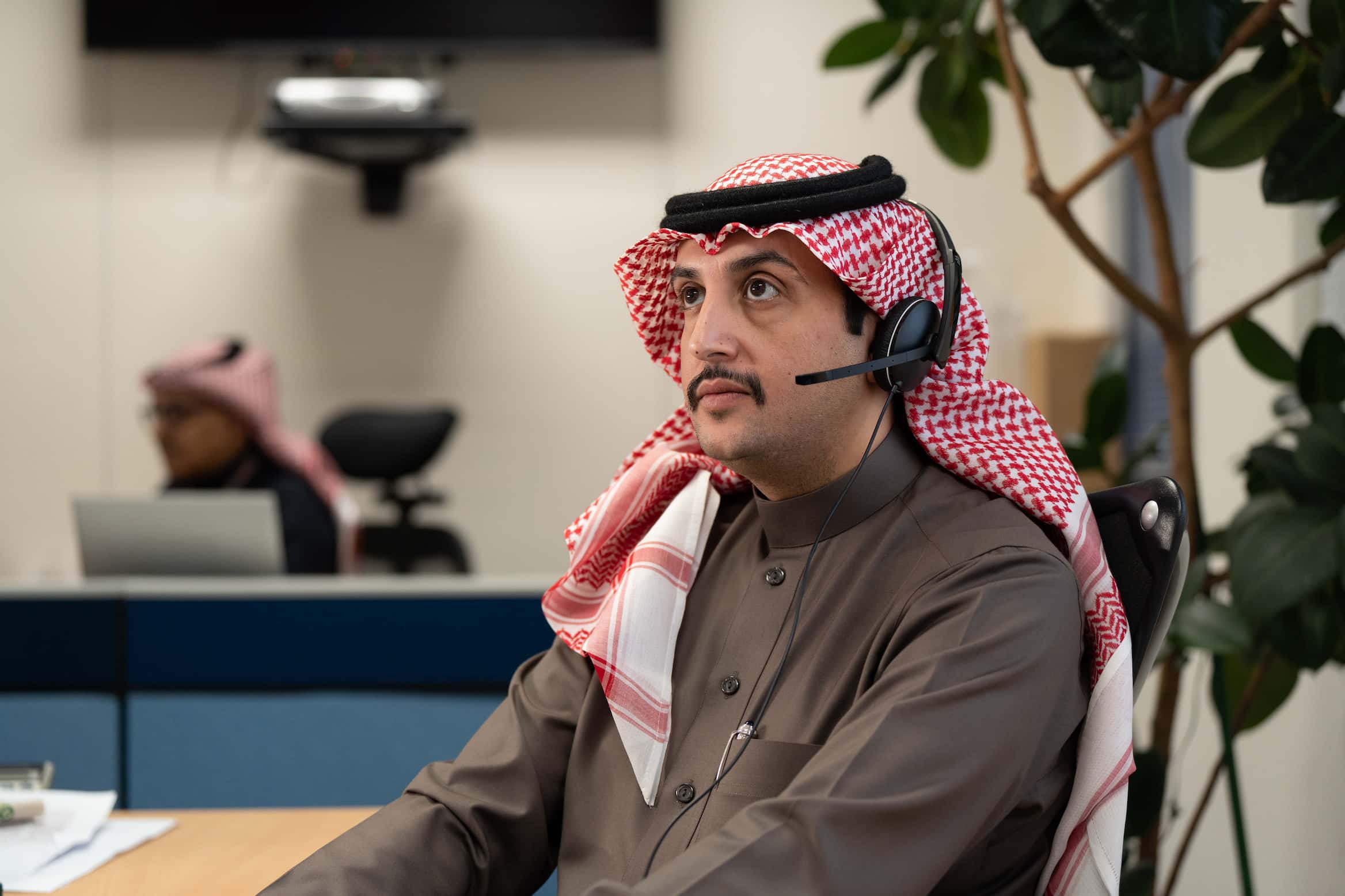 Employees wearing ghutras in the office