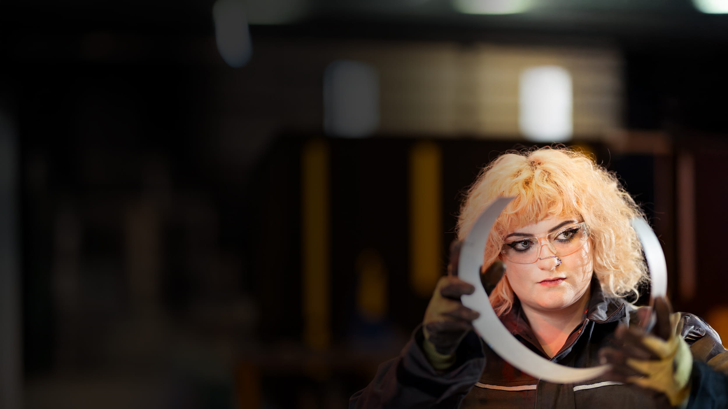 Woman holding metal circle